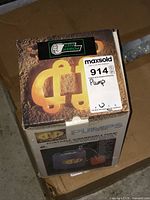 Photo of the box with visible CSP branding and MaxSold auction label showing the lot number and title.