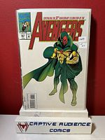 Front cover of Avengers #367 comic book showing character in green and gold costume with cape and Avengers logo.