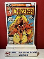 Front cover photo of Dazzler #8 Marvel comic book, graded VF and priced at $6, displayed in protective comic book sleeve against red background.