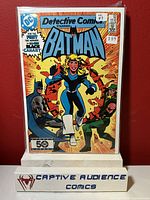 Image of Detective Comics #554 comic book featuring Batman, Black Canary, and Green Arrow on the cover, bagged and boarded.