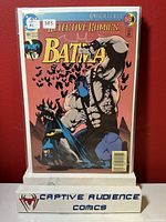 Photo of Detective Comics #664 comic book from Knightfall series showing the front cover with Batman and Bane artwork and visible VF- grading sticker.