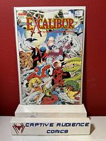 Front cover of Excalibur #1 comic book with price stickers and colorful illustration by Bryan Hitch and David Neon.