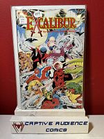 Front cover of Excalibur #1 comic book showing colorful characters and title logo.