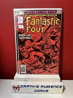 Comic book Fantastic Four #220, showing the front cover featuring classic Marvel characters on a red background.