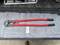 Full view of the 36-inch bolt cutters showing red handles, black grips, and cutting head
