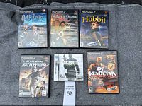 Six video game titles displayed including five PlayStation 2 games and one Nintendo DS game.