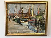 Full view of the framed oil painting depicting a harbor with boats and pier