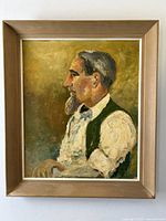 Oil painting showing a distinguished gentleman in profile, framed