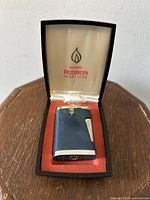 Vintage Ronson Varaflame blue and chrome pocket lighter in original fitted case with satin and felt lining.