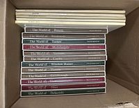 Box with spines of Time-Life "The World of" art books and Abrams art books with color plates.