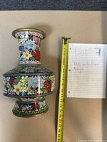 Full view of the cloisonné vase with tape measure showing height approximately 18 cm.