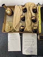 Box containing Murano glass set with six cups, flask with lid, packing paper and two pieces of paper notes.