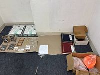 Lot overview showing all items in two wide shots including salt lamp, picture frames, photo albums, closet organizers, car light box and small accessories.