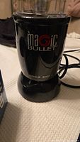 Magic Bullet Single Shot blender in black with clear blending cup, gently used condition