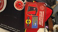 Box of Premium Roadside Kit labeled 'Auto Safety Kit' with roadside assistance logo