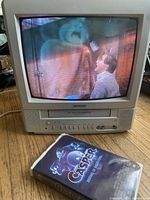 Front view of Toshiba CRT TV playing Casper VHS tape showing movie scene on screen with Casper VHS tape case in front.