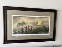 Front view of framed 'Remuda' print showing the horses scene and signature.