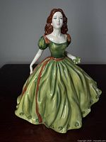 Front view of Royal Doulton Irish Charm figurine showing full dress and face.