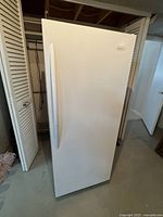 Front view of upright freezer showing exterior condition