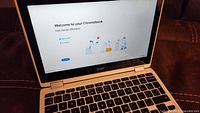 Open Acer Chromebook showing welcome screen on 11.6 inch touchscreen.