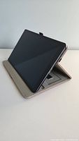 Tablet propped upright in leather folio case