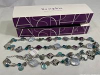 Full view of Lia Sophia Ocean Air necklace and its original branded box showing the entire length and bead details.