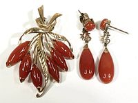 Brooch and earrings set showing the design and red carnelian stone accents