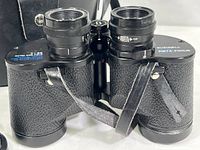 Front view of Bushnell Insta-Focus binoculars showing textured body and focus adjustment.
