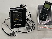 Close-up of Sony WM-AF604/BF604 Walkman showing Mega Bass and Auto Reverse features.