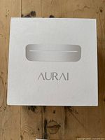 White box with Aurai branding containing the product packaging.