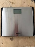 Top side of the EatSmart Precision 550 digital scale showing stainless steel surface and digital display window.