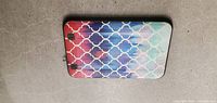 Back view of Amazon Fire Tablet with colorful geometric pattern silicone case.