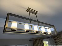 Fixture installed and lit showcasing brushed nickel rectangular frame with five glowing glass shades