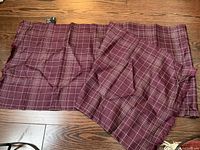 Full view of the burgundy silk scarf laid flat showing grid pattern and size proportion