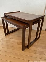 Angled view of two nesting tables stacked
