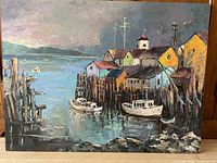 Full view of painting showing harbor, buildings and boats
