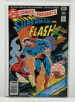 Full front cover of the comic book showing Superman and The Flash running, with a hoverboard villain in background, the comic is bagged and boarded.