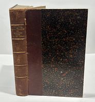 Front cover and spine of the 1905 hardcover book 'La Psychologie Des Romanciers Russes Du XIXe Siècle' showing marbled boards and brown leather spine with title on spine.