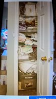 Photo of linen closet showing stacked folded linens, curtains, towels, and boxed bedding items.