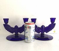Pair of cobalt blue glass candlesticks with a soda can for scale, showing the size and details of the base and candle holders.