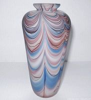 Front angled view of the frosted glass vase showing the swag pattern in blue, pink, and black against white.