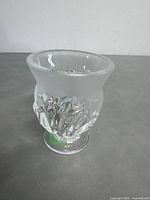 Side view of Lalique clear glass bowl with frosted decorative motif showing shape and design