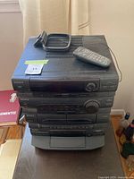 Front and top view of the vintage Sony stereo system stack with remote on top.