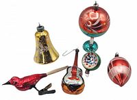 Photo showing all six vintage glass Christmas ornaments arranged on a white background including the bell, bird, guitar, green and red round bulb, and two red and silver bulb-shaped ornaments.