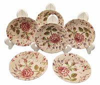 Front view of six vintage Johnson Bros Rose Chintz small bowls showing the floral pattern and scalloped edges.
