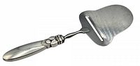 Full view of vintage Georg Jensen sterling silver cheese cutter, showing handle and blade.