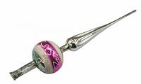 Glass vintage Christmas tree topper ornament with pink and green decorative reflective bands and pointed silver finials, shown against white background