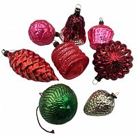 All eight vintage glass Christmas tree ornaments arranged on white background showing multiple colors and shapes.