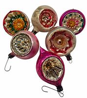 Set of six vintage glass Christmas tree ornaments with colorful reflective floral and geometric designs, showing varied shapes and metal hanging hooks.