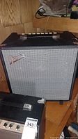 Front view of Fender Rumble 40 bass amp showing silver grille cloth and Fender logo.